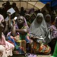 Women wait for food distribution in the town of Banki in northeastern Nigeria in April 2017 as conflict and the risk of famine heighten