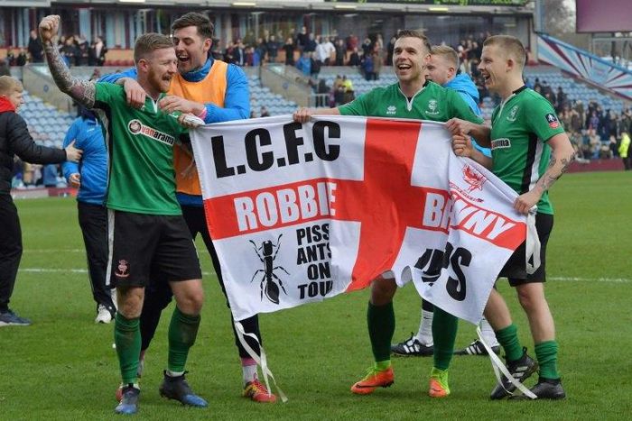 Lincoln City celebrate their FA Cup fifth round victory against Premier League side Burnley on February 18, 2017