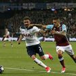 Tottenham Hotspur's defender Kyle Walker (L) vies with West Ham United's midfielder Manuel Lanzini during the English Premier League football match May 5, 2017