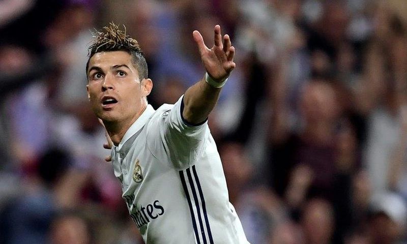 Real Madrid's Cristiano Ronaldo celebrates after scoring against Atletico Madrid during their Champions League match at the Santiago Bernabeu stadium on May 2, 2017
