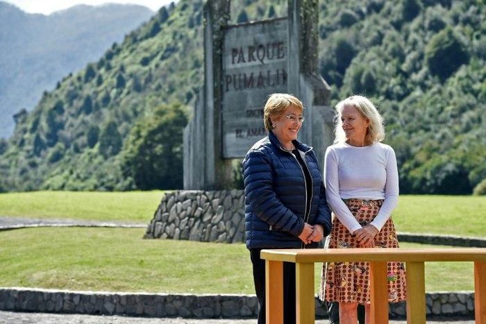 Chilean President Michelle Bachelet (left) and Kristine McDivitt Tompkins signed the land donation document at Parque Pumalin, on March 16, 2017