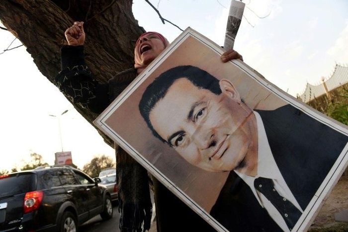 Supporters of Egypt's former president Hosni Mubarak chant slogans outside a military hospital in Cairo on March 2, 2017