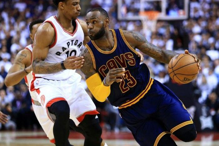 Lebron James of the Cleveland Cavaliers breaks past DeMar DeRozan of the Toronto Raptors in Game Three of the Eastern Conference Semifinals