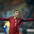 Portugal's forward Cristiano Ronaldo celebrates after scoring a goal during the WC 2018 football qualification match between Portugal and Andorra at the Municipal de Arouca stadium in Aveiro on October 7, 2016