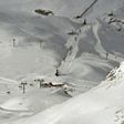 A late-season avalanche killed two skiers and their guide in the French Alps near the Italian border, local officials said