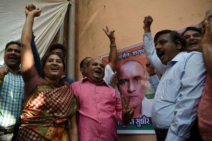 Friends of Indian national Kulbhushan Jadhav celebrate in Mumbai on May 18, 2017 after he is given a stay of execution in a high-profile case at the International Court of Justice
