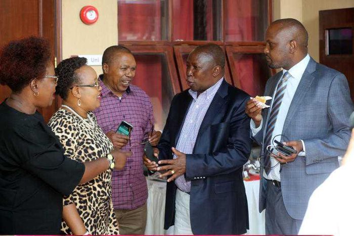 File image of Maina Kamanda (in black coat) with fellow leaders at a past function He has warned that the Mt Kenya region may form a coalition with other communities