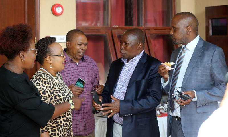File image of Maina Kamanda (in black coat) with fellow leaders at a past function He has warned that the Mt Kenya region may form a coalition with other communities