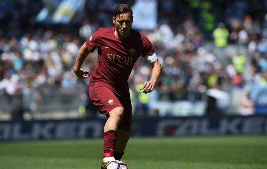 Roma's forward from Italy Francesco Totti controls the ball during the Italian Serie A match against Lazio at the Olympic Stadium in Rome on April 30, 2017