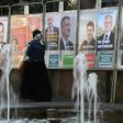 Campaign posters for the French presidential candidates cover a wall in Strasbourg, eastern France