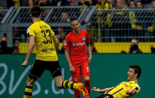 Dortmund's Sokratis Papastathopoulos celebrates after scoring a goal during their German first division Bundesliga match against Eintracht Frankfurt, in Dortmund, on April 15, 2017