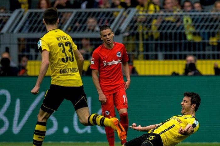 Dortmund's Sokratis Papastathopoulos celebrates after scoring a goal during their German first division Bundesliga match against Eintracht Frankfurt, in Dortmund, on April 15, 2017