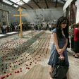 Mourners gather inside the Beslan school gymnasium at the school in North Ossetia on September 1, 2009 as they commemorate the fifth anniversary of the 2004 terrorist massacre