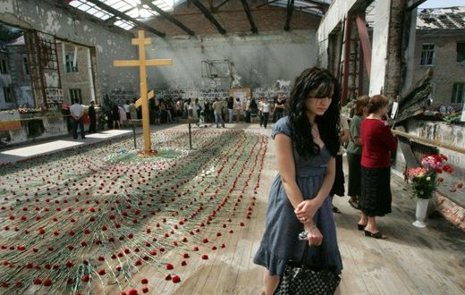 Mourners gather inside the Beslan school gymnasium at the school in North Ossetia on September 1, 2009 as they commemorate the fifth anniversary of the 2004 terrorist massacre