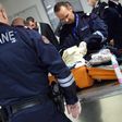 French customs officers check luggage at Roissy Charles de Gaulle airport, north of Paris on March 17, 2015