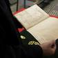 A man reads a manuscript on astronomy by renowned tenth century Muslim philosopher Al-Farabi, at the al-Qarawyin Library on November 21, 2016