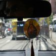 A Filipino taxi driver displays a religious icon inside his vehicle in Manila