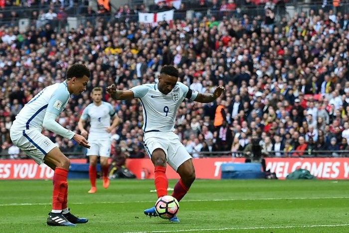 England's striker Jermain Defoe (C) shoots to score his team's first goal during the World Cup 2018 qualification football match between England and Lithuania at Wembley Stadium in London on March 26, 2017