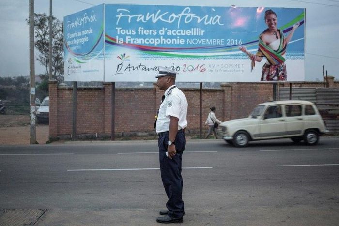 A Malagasy traffic policeman directs the traffic on the outskirts of Antananarivo on November 24, 2016