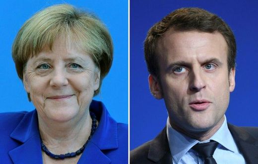 German Chancellor Angela Merkel (L) said she had "absolutely no doubt that Emmanuel Macron (R) will be a strong president if he is elected"