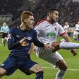 Leipzig's Timo Werner (L) and Augsburg's Raul Bobadilla vie for the ball during their Bundesliga match in Augsburg, southern Germany, on March 3, 2017