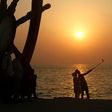 Tourists take a selfie on the seafront on Iran's southern resort island of Kish