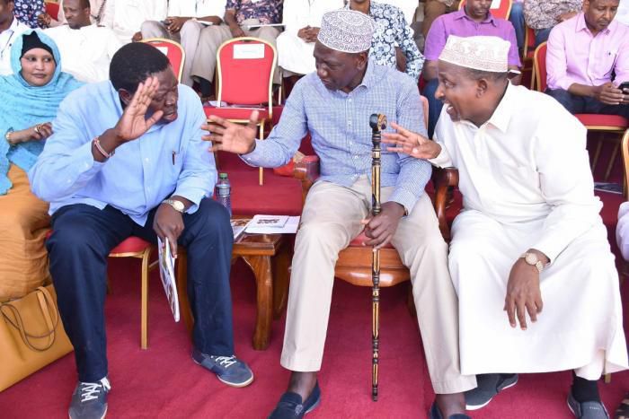 DP Ruto (Centre) with Devolution CS Eugene Wamalwa (Left) and Majority leader Aden Duale in Mandera on Saturday where he flagged of relief food supplies