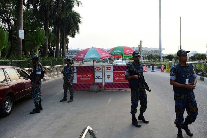 Bangladesh security personnel guard the entrance of Hazrat Shah Jalal International Airport in Dhaka on March 17, following a suicide bomb attack on a military camp in the city