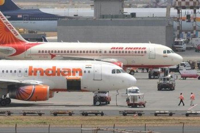 A politician has admitted hitting an air steward on an Air India flight with a slipper 25 times