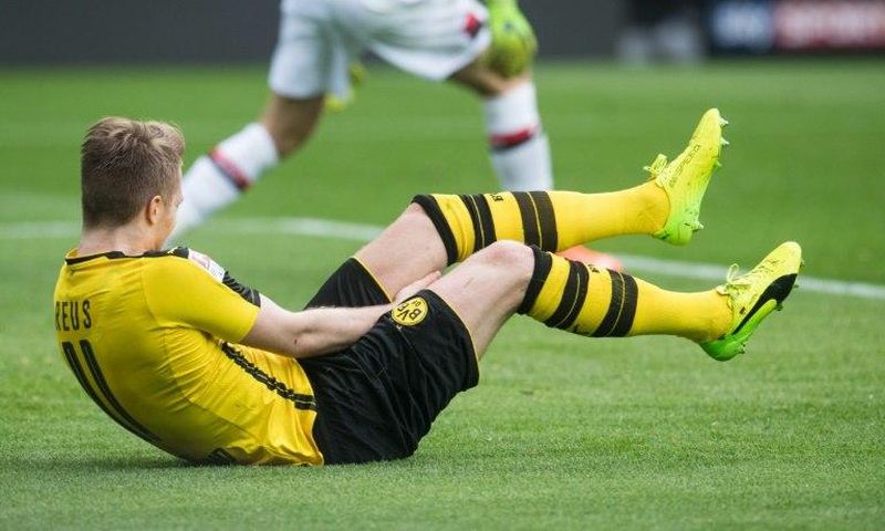 Dortmund's forward Marco Reus falls during the German First division Bundesliga football match against Bayer 04 Leverkusen March 4, 2017