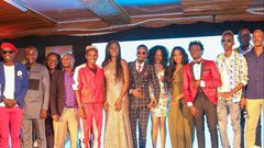 Celebrities at the EMB Rebirth Party . Bahati signs Dany Gift