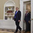 US President Donald Trump and Vice President Mike Pence walk into the Oval Office at the White House