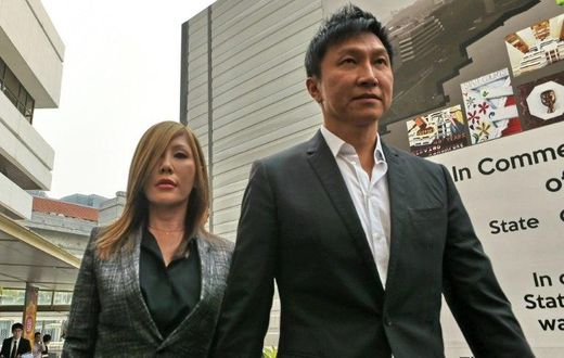 City Harvest Church founder Kong Hee (R) has had his jail sentence for misusing church funds to boost the career of his pop-singer wife Ho Yeow Sun (L) reduced on appeal