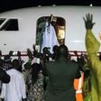 Former Gambian president Yahya Jammeh waves from the plane as he leaves the country he ruled for 22 years on 21 January 2017
