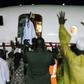 Former Gambian president Yahya Jammeh waves from the plane as he leaves the country he ruled for 22 years on 21 January 2017