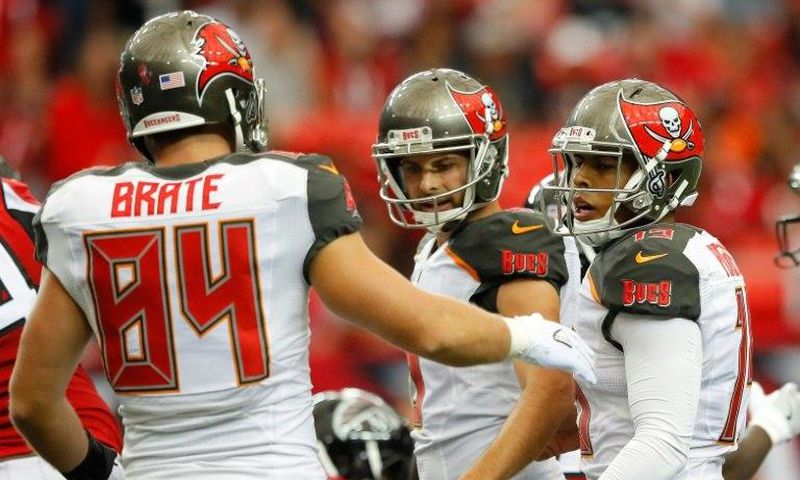 Roberto Aguayo (R) of the Tampa Bay Buccaneers is congratulated by teammates after kicking a field goal during a NFL game at Georgia Dome in Atlanta, in September 2016