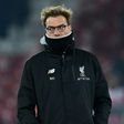 Liverpool's coach Jurgen Klopp watches as his players warm up ahead of the EFL Cup semi-final second-leg football match against Southampton on January 25, 2017
