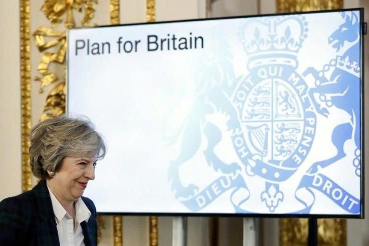 British Prime Minister Theresa May said MPs would be presented with a "white paper" policy document outlining her Brexit negotiating strategy, though she did not say when it would be published