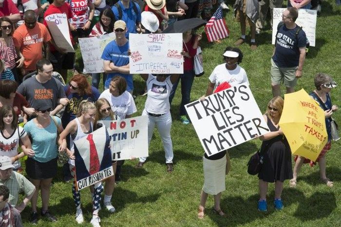 People converged around the Washington Monument in the US capital to demand a full and independent investigation of the allegations that Trump or his aides might have colluded with Russia