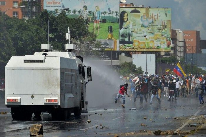 Opposition activists clash with the riot police during a demonstration against President Nicolas Maduro's government in Caracas, on May 29, 2017