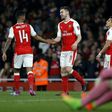 Arsenal's Aaron Ramsey (2nd L) celebrates with teammate Theo Walcott (L) after scoring their fifth goal against Lincoln City at The Emirates Stadium in London on March 11, 2017