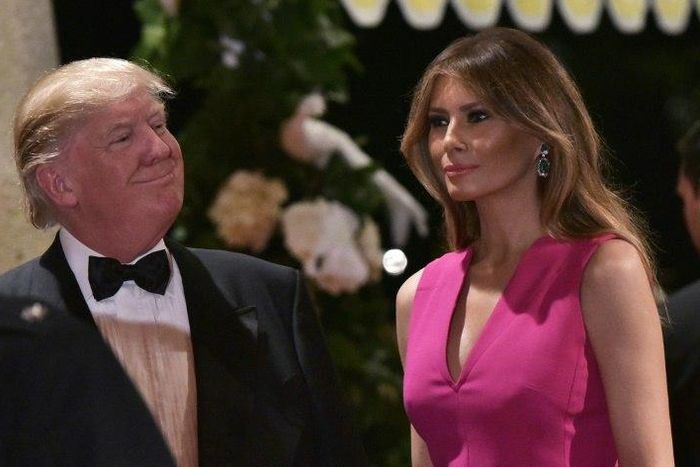 US President Donald Trump and First Lady Melania Trump arrive for the 60th Annual Red Cross Gala at his Mar-a-Lago estate in Palm Beach