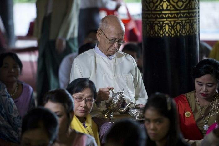 Taw Phaya (C), 93, grandson of King Thibaw, attends a ceremony with relatives at Mandalay's Golden Palace on November 22, 2016 to mark the exile anniversary of their royal ancestor