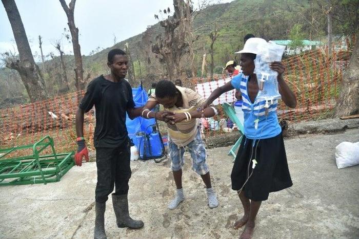 A patient with cholera symptoms arrives in a hospital of field of Samaritan's Purse to receive medical attention in Randelle, Haiti