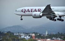 A Qatar Airways plane lands at Los Angeles International Airport