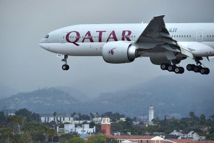 A Qatar Airways plane lands at Los Angeles International Airport