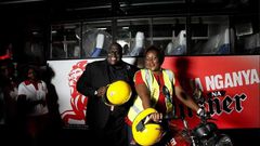 Pilsner Marketing Manager, Samuel Wasswa and Pilsner Senior Brand Manager, Truphena Malaki on the KBL/Pilsner bike to be worn