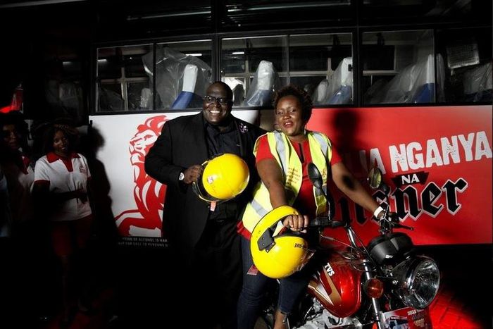 Pilsner Marketing Manager, Samuel Wasswa and Pilsner Senior Brand Manager, Truphena Malaki on the KBL/Pilsner bike to be worn