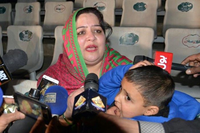 Pakistani mother Rohina Kiani holds her son Ifthikar Ahmed after he was handed over by an Indian official at the Wagah border, on February 4, 2017