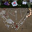 Floral tributes, messages and candles are left in Manchester in tribute to the victims of Monday's attack at a concert venue in the city